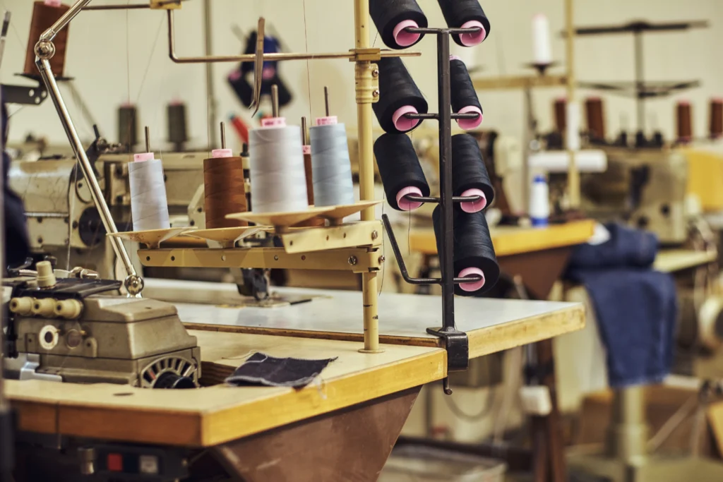 close up image lot coils with threads sewing workshop